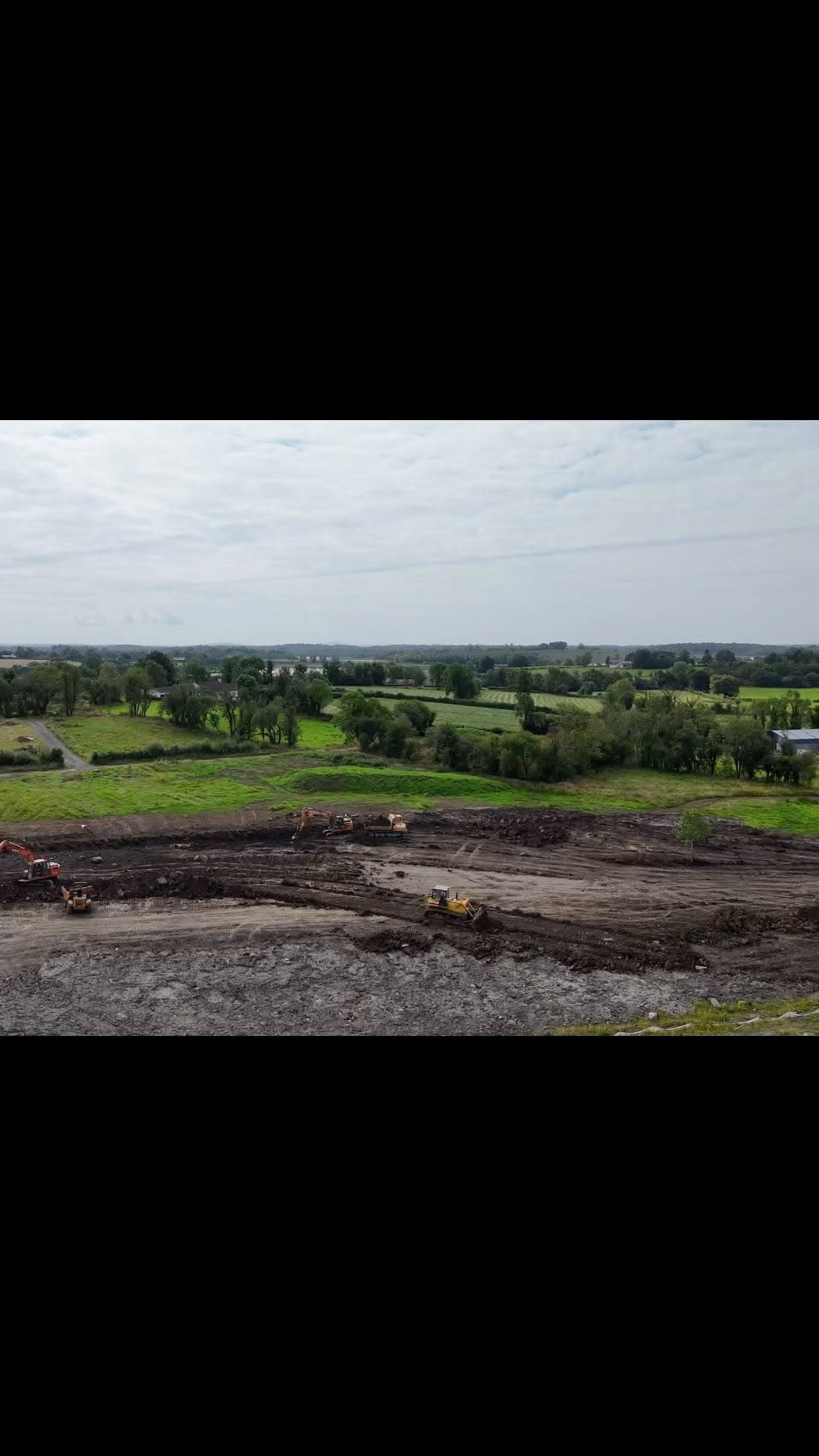 Excavator and plant on a large cut and fill groundworks site